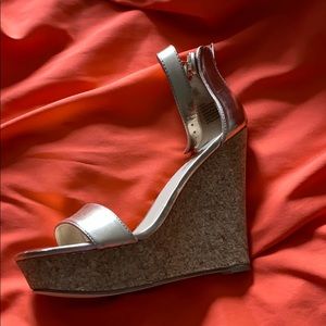 Brand new, never worn healed wedge sandal.